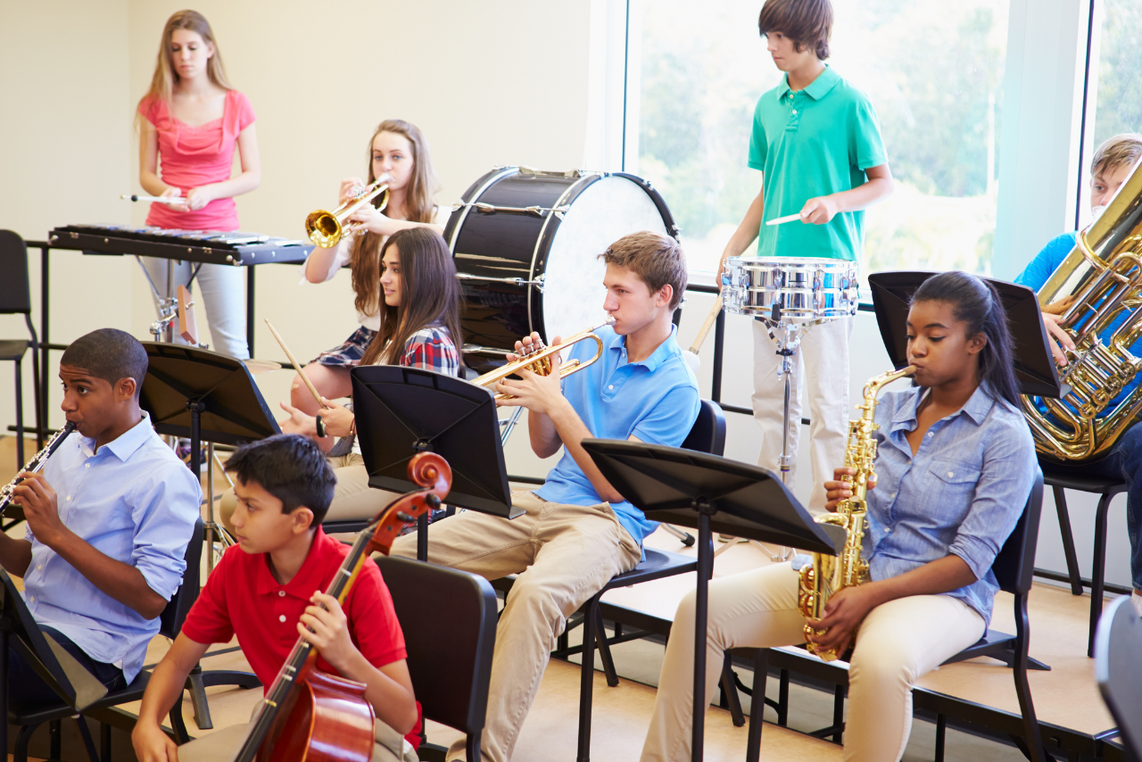 multi aged kids performing together in a beginning band